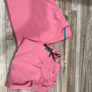 Pink jogger scrub set 
Size:Lg
Fabletics brand 
Pet & smoke free home
Wore once